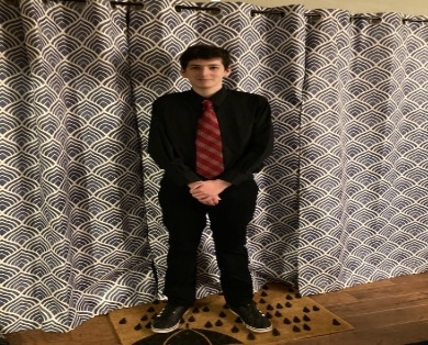 An image of a man in a suit and tie